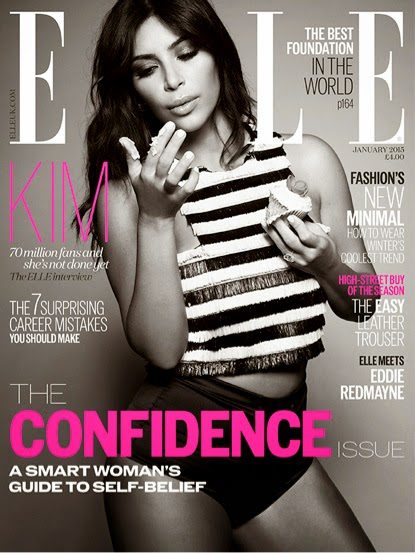 Kim Kardashian West in a striped crop top and hot pants, holding a cupcake on the cover of Elle.